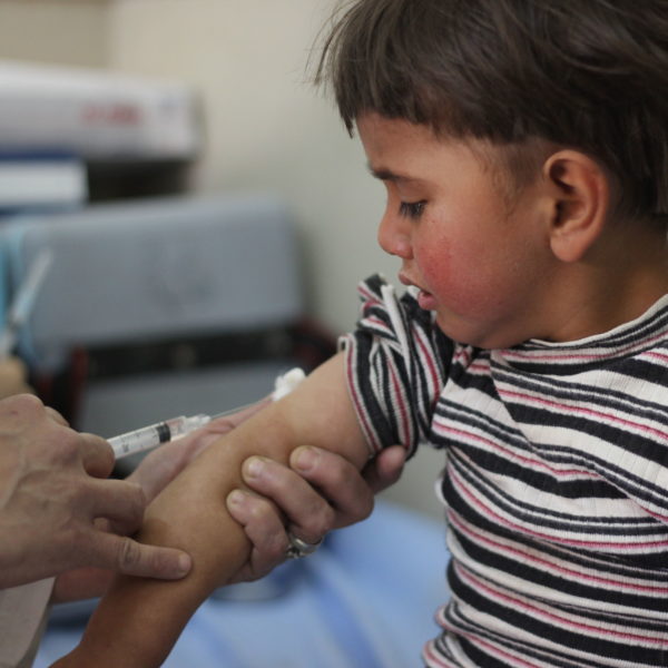 On 26 April 2016, Louai, 4, is vaccinated in Aleppo City as part of Syria's first ever nationwide routine immunization campaign since the start of the five year conflict. Until recently, the siblings lived in Al-Bab town in rural eastern Aleppo, one of the most dangerous areas to live due to the war. Their mother recently fled with her children to shelter with relatives in Aleppo city. Hearing about the campaign from neighbours, she took her four children to the nearest health centre, along with their cousin. The first full nationwide immunization campaign since the start of the five-year conflict in Syria, began on 24 April 2016, at the start of World Immunization Week. The campaign, supported by UNICEF and WHO, aims to reach all children under the age of five years old including those living under siege and in hard-to-reach areas, where routine vaccination is almost non-existent and many children have never received any vaccinations. Access to children in these areas is key to the success of the campaign. After five years of conflict, national immunization rates have dropped from 90 per cent to 57 per cent, putting the country's 2.8 million under-five-year-old at risk of life-threatening vaccine preventable diseases. In this campaign, children will be immunized against polio, measles, rubella, pertussis (whooping cough), diphtheria, tetanus, hepatitis B and haemophilus influenza type B. Access for health workers is critical to protect these children from deadly diseases. Vaccination is being provided through fixed health centres, outreach activities and mobile teams where required.