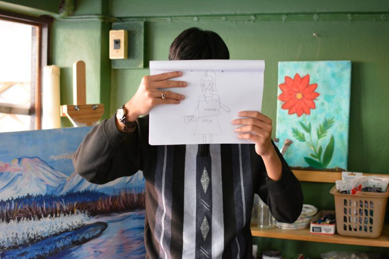 Saeng holds a picture