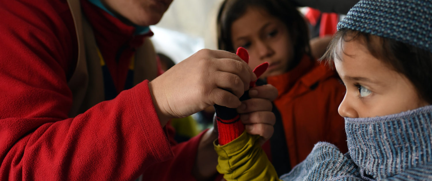 A young girl receives a hat, scarf and gloves in the former Yugoslav Republic of Macedonia. Unicef 2015 Georgiev