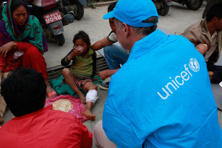 A Unicef worker talks with the mother of a young girl, injured in Nepal's recent earthquake, at the Tribhuvan University Teaching Hospital in Kathmandu.