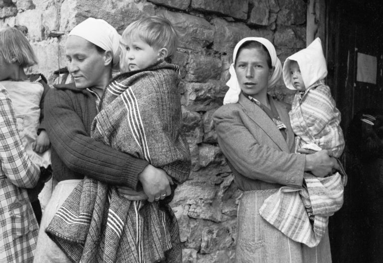 Women in rural Greece in 1950 bring their sick children to a Unicef-supported mobile health clinic. You can find out more about Gifts in Wills on this page.